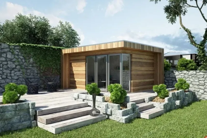 Garden room with timber decking and steps built on ground screw foundations