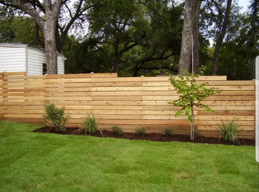 Timber fence panels installed on ground screw posts instead of concrete