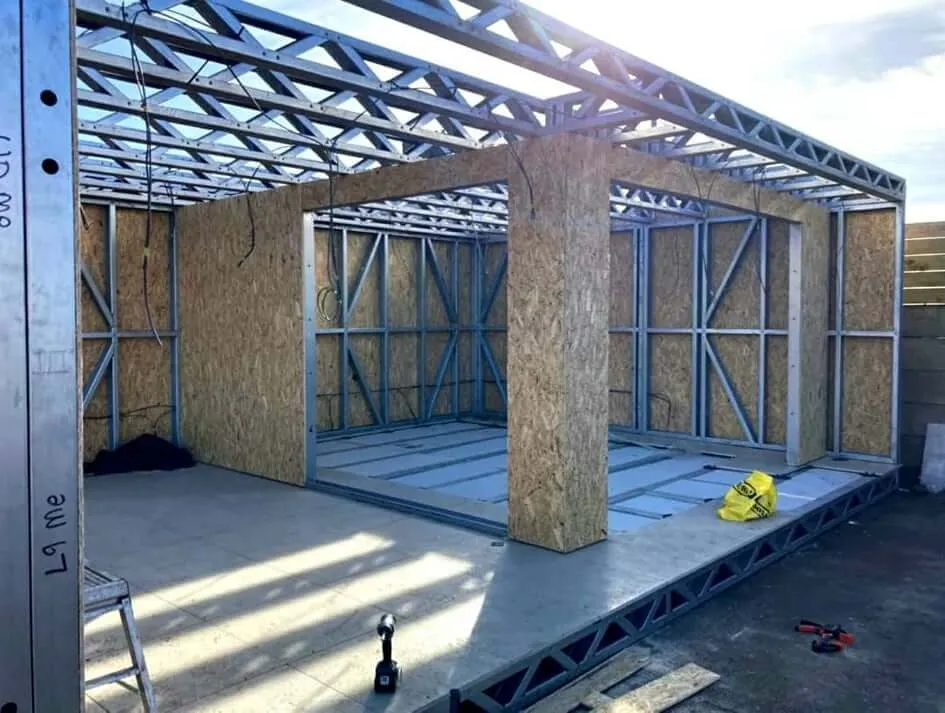 Garden building frame sheeted out on ground screw foundations