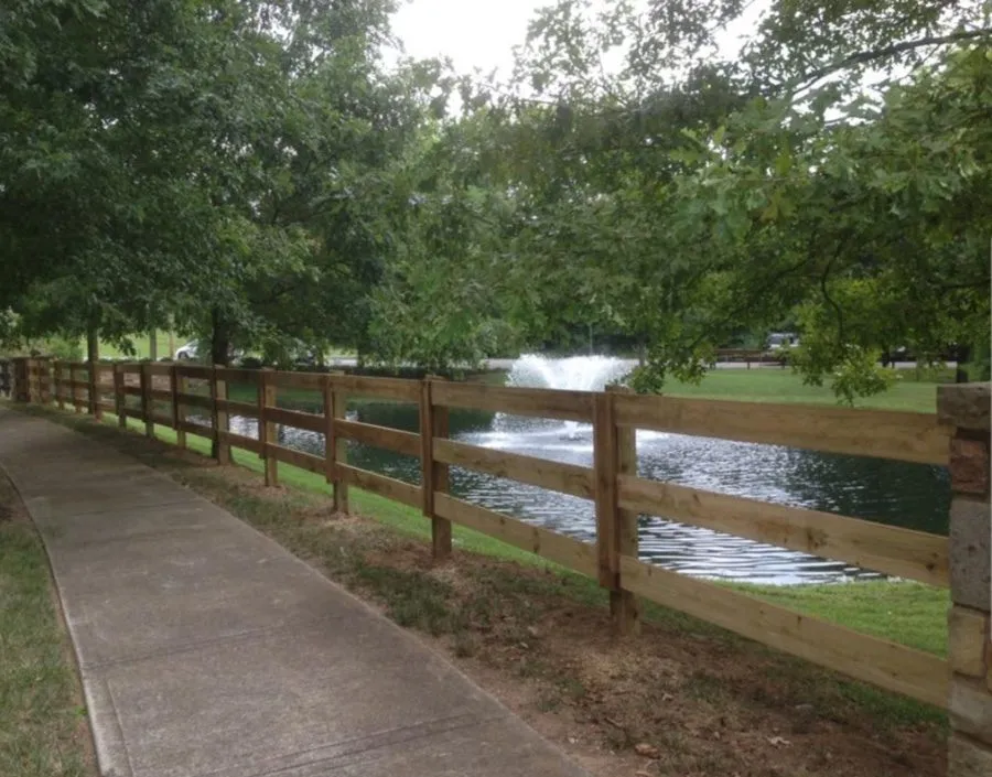 Boundary fence panels fixed to ground screw posts