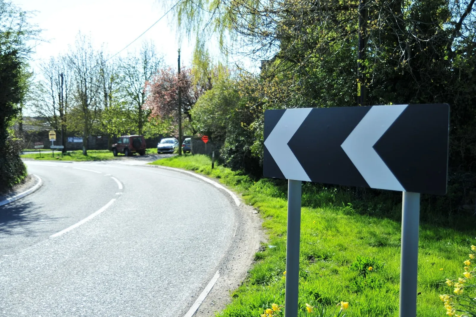 Post mounted roadside chevron signage installed on ground screw foundations